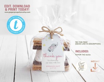 Op de afbeelding: Een roze en witte bedankkaart met een schattige olifant-illustratie en de tekst "thank you for showering our baby with love Stephanie & Matt 3.27.21". Het kaartje is vastgebonden met touw aan een stapel graham crackers, chocolade en marshmallows, een s'mores-traktatie.