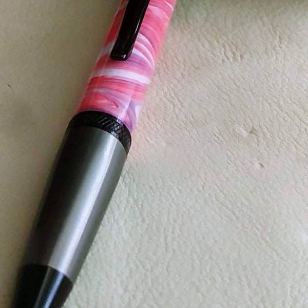 Beautifully elegant acrylic pen. Custom made and hand poured to give you a one of a kind piece of art that you write with.