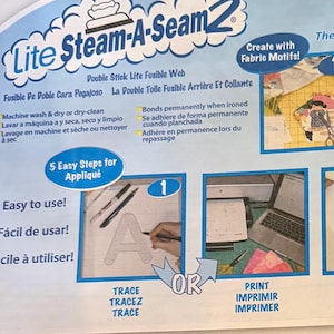 May include: Lite Steam-A-Seam 2 double stick lite fusible web packaging featuring blue and white text. The product label includes instructions for machine washing and dry cleaning, along with a visual guide for tracing or printing fabric motifs.