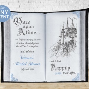 May include: A blue and white illustrated book backdrop with the text "Once upon a time..." and "Let's celebrate Venessa's Bridal Shower July 16th, 2021" and a drawing of a castle on a mountain with the text "...and she lived Happily Ever After."