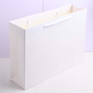 Design Packaging Luxury Texture Paper Scarves Clothing Gift Bags Uncover  Branded Paper Packaging Box with Custom Branding - China Paper Bag and  Doggie Paper Bag price
