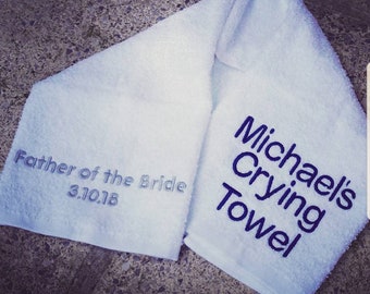 May include: White towel with blue embroidery that reads "Michael's Crying Towel" and "Father of the Bride 3.10.18"