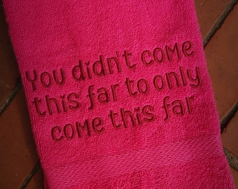 May include: A pink towel with the embroidered text "You didn't come this far to only come this far."