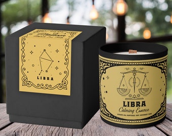 May include: A black candle jar with a gold label featuring the Libra zodiac sign and the text "Libra Calming Essence Vegan All Natural Soy Coconut Wax".