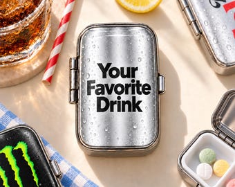 May include: A rectangular metal pill case with a silver finish and water droplets on the surface. The text Your Favorite Drink is printed in black on the lid. The case features a hinged closure and a white plastic interior divider.