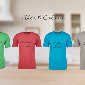 May include: Four t-shirts in different colors: vintage green, vintage red, arctic blue, and silver. The shirts are all crew neck and short-sleeved.