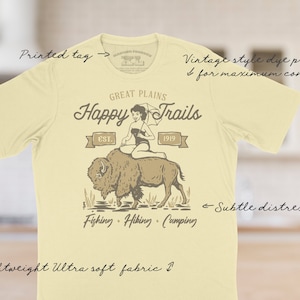 The Happy Trails tee has a vintage distressed design.  These shirts are so buttery soft and comfy that you will want to wear it year round.  The designs and tags are dye printed for  comfort.   The shirts are available in many sizes and colors.