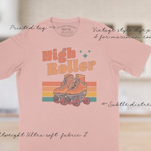 The High Roller tee has a vintage distressed design.  These shirts are so buttery soft and comfy that you will want to wear it year round.  The designs and tags are dye printed for  comfort.   The shirts are available in many sizes and colors.