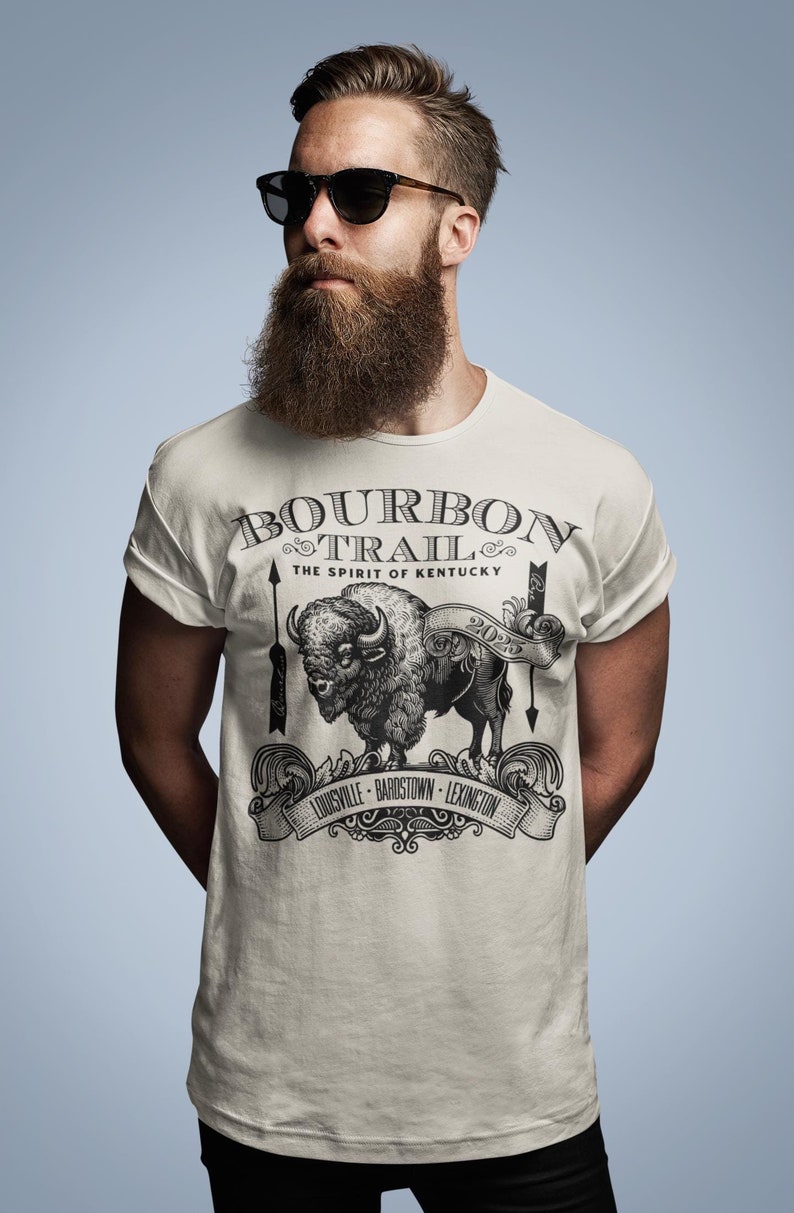 Follow the hoof prints of history and sip your way through the legendary Kentucky Bourbon Trail! Featuring a bold, rustic buffalo design, this tee pays tribute to Kentucky’s rich distilling heritage and the spirit of the American frontier.