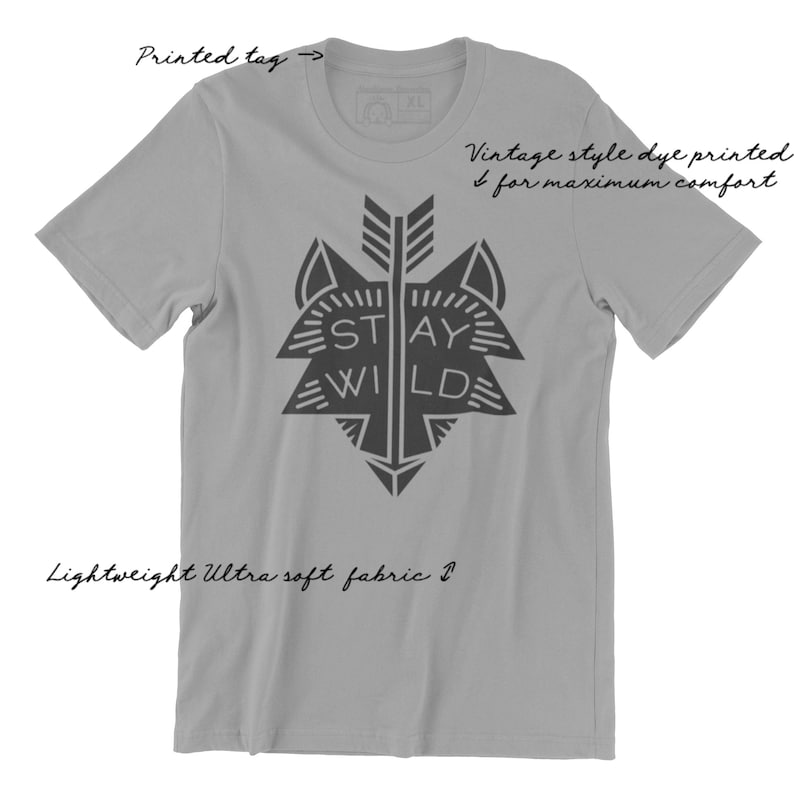 May include: Gray t-shirt with a black wolf graphic and the text "STAY WILD". The shirt is made of a lightweight, ultra-soft fabric and features a vintage style dye print.