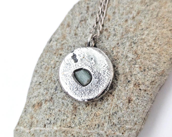 sandcast silver pendant with raw emerald, brutalist  style, natural rustic texture, anniversary gift, coin shape, unisex, pendant only