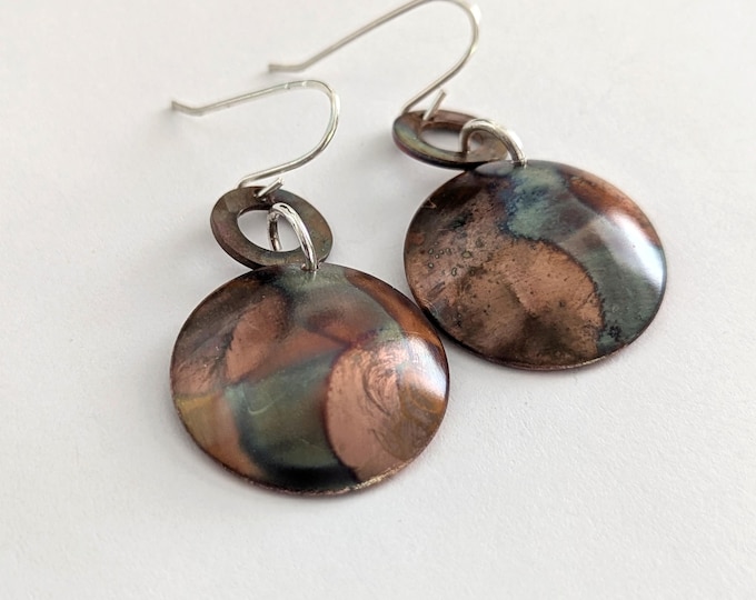 Domed dangle earrings; flame painted copper, sterling silver hooks