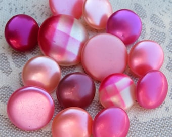 14 antique waxed glass knobs, collector's items, 13.5 mm - 18 mm, silky smooth surfaces in various shades of red, some with geometric designs.