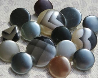 14 antique waxed glass knobs, collector's items, 13.5 mm - 18 mm, silky smooth surfaces in black and grey tones, some with geometric designs.