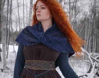 Handwoven twisted capelet in blue and brown shades.