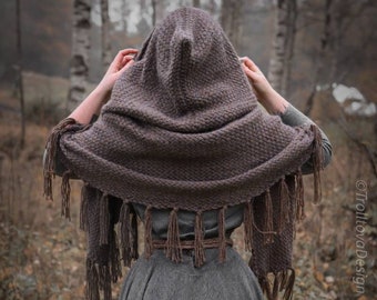 Big handwoven hooded shawl in brown shades.