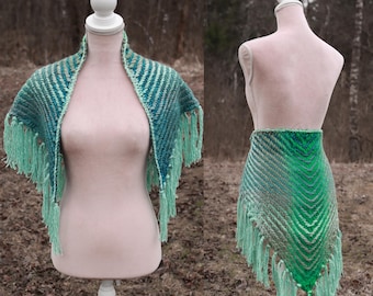 Handwoven triangle shawl made from yarn scraps in turquoise and green gradient shades.