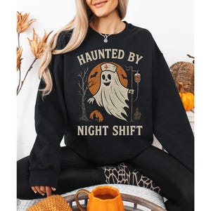 Nurse Halloween Sweatshirt – Haunted By Night Shift Ghost Nurse Crewneck – Spooky Nurse Gift, Night Shift Nurse Fall Sweatshirt