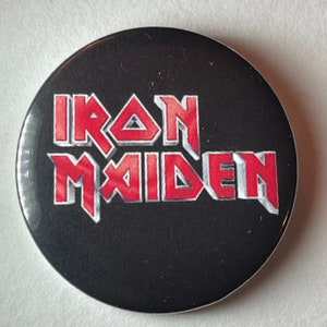 Iron Maiden bold logo new, 2 1/4 inch in diameter pin/ button or magnet