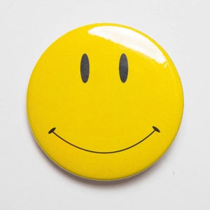 Smile The famous yellow have a nice day smiley face 2 1/4 inch Pin / Button or magnet