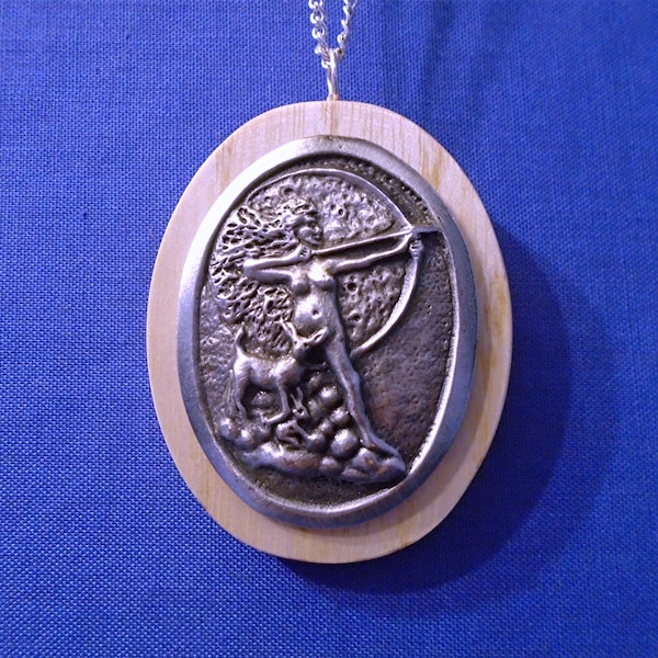 Handmade Wooden Oval Pendant with A Pewter *Diana*  Goddess of the Bow. On an 18" Chain. Makes a lovely gift it comes in a presentation box