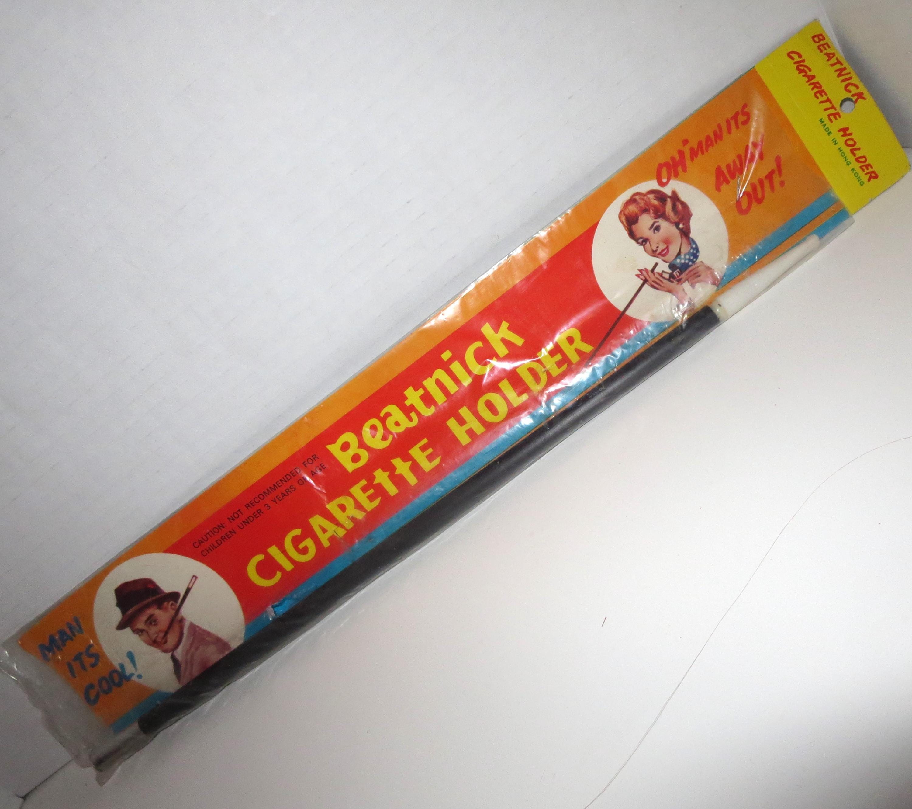 tobacco holder crossword clue Vintage 60's Novelty BEATNIK CIGARETTE HOLDER in Package Dime Store Costume