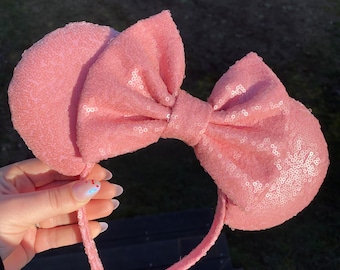 Orejas milenarias de lentejuelas rosas