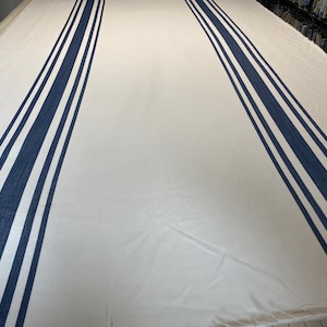 3.5 Yards available of this Designer navy and white striped fabric or custom pillows made from this!