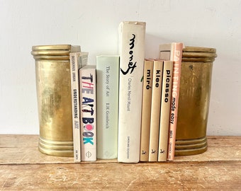 Vintage pair of Regal Brass pillar weighted book ends