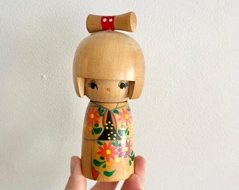 Vintage wooden Kokeshi doll with flowers