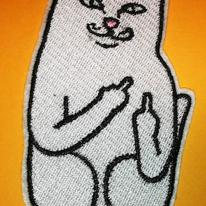 May include: Embroidered patch of a cartoon cat, seated and giving the middle finger with both paws. The cat is light grey with black outlines and pink nose and ears. The patch is set against a yellow background.
