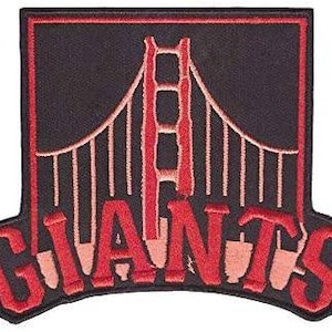 May include: Embroidered patch featuring the Golden Gate Bridge in red and tan, set against a black background. The word "GIANTS" is arched below the bridge in red, with a black border.