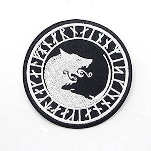 May include: Embroidered patch featuring a white wolf design on a black background, encircled by white runes. The patch is round and has a detailed, textured appearance, suitable for clothing or accessories.
