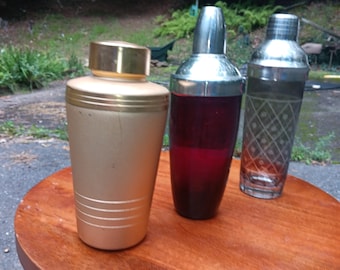 Three Vintage Cocktail Shakers Ruby Glass Diamond Cut Crystal Mirro MCM Aluminum Oversized Gold Tone