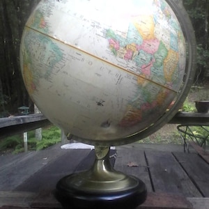 Globemaster Replogle Globe 12-inch raised relief globe, 3-D topography, nicely aged metal brace and base, slight wear on bottom