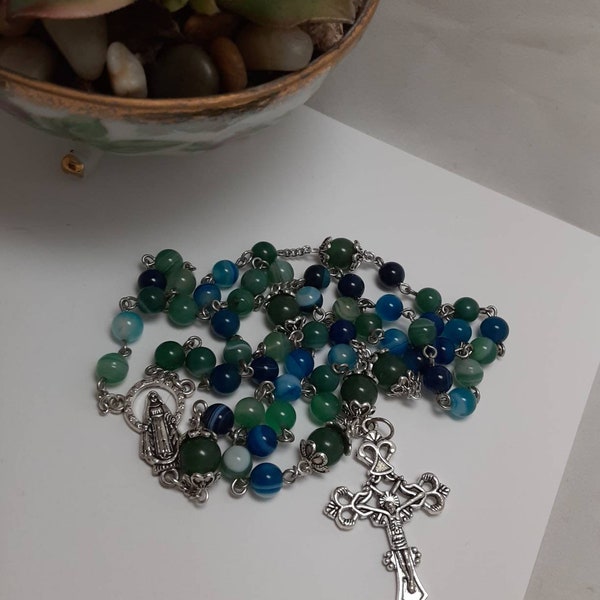 Soothing ocean colors in this hand crafted five-decade rosary