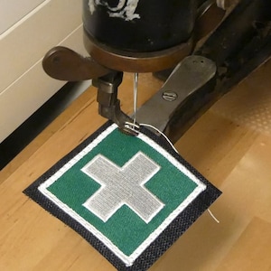 Service: Att sy fast kardborreband på din köpta lapp