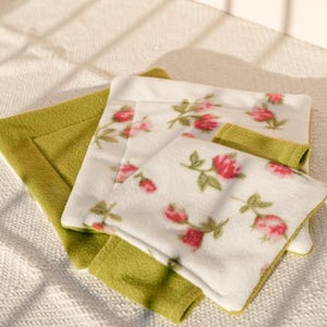 May include: A white ceramic mug with a black handle and the text "But First, Coffee" in a bold, black font. The mug is set against a neutral background, highlighting its simple design.