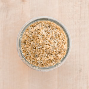 Dried elderflower for rabbits, guinea pigs, and chinchillas in a glass jar