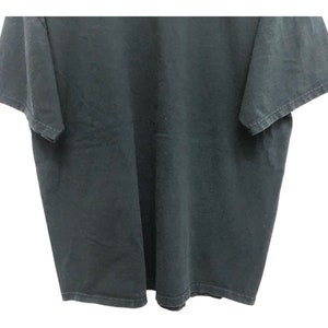 May include: A black t-shirt with short sleeves.