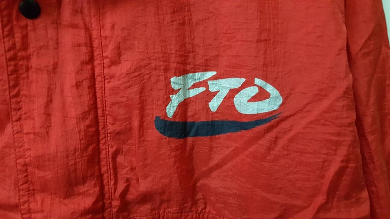 May include: Red jacket with a white and black logo that says "FTO" on the front.