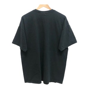 May include: A black short-sleeved t-shirt with a crew neck.