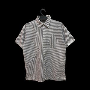 May include: A short-sleeved button-down shirt featuring a white base with thin horizontal black stripes. The fabric displays a geometric pattern where the stripes shift direction to form diamond shapes on the chest and lower left side.