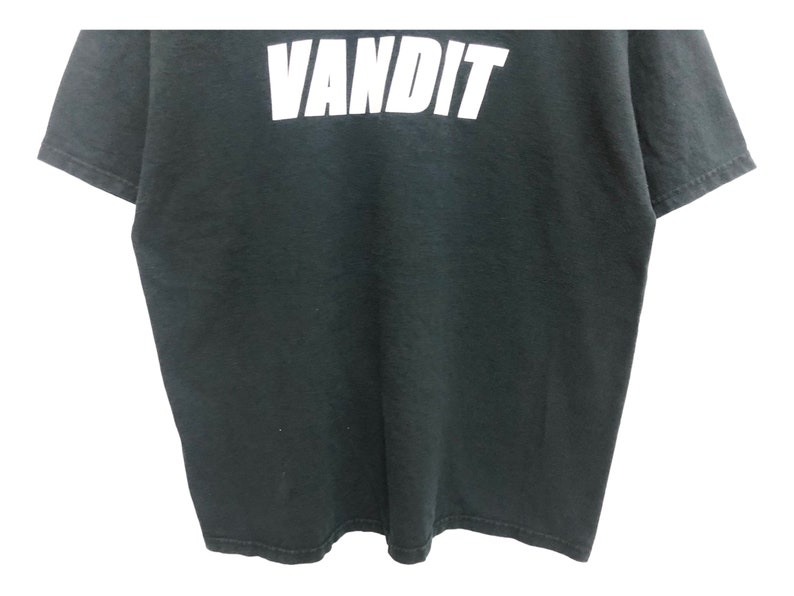 May include: Black t-shirt with the word "VANDIT" printed in white on the front.