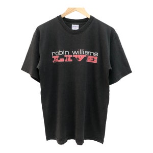 May include: Black t-shirt with a white graphic that says "robin williams LIVE" in red letters.
