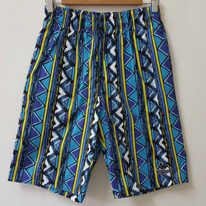 May include: Blue, yellow, and white patterned shorts with a black logo that says "Kappa" on the right leg.