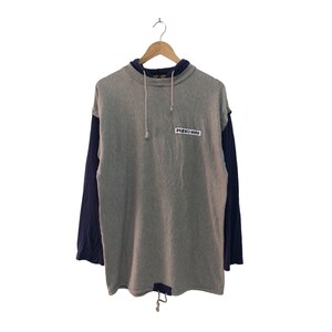 May include: Grey and blue long-sleeved sweatshirt with a drawstring hood and a "Piero Mini" logo on the front.