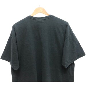 May include: A black t-shirt with a crew neck and short sleeves.