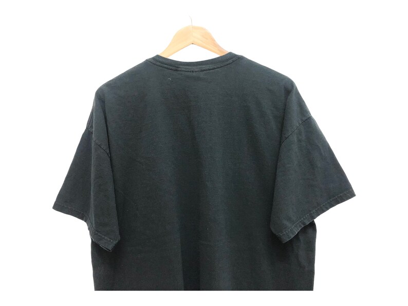 May include: A black t-shirt with a crew neck and short sleeves.