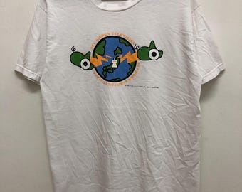 Maskotka NANDARŌ z lat 90. z 1992 r. autorstwa studia Ghibli Hayao Miyazaki na potrzeby rocznicowej koszulki stacji telewizyjnej NTV Nippon